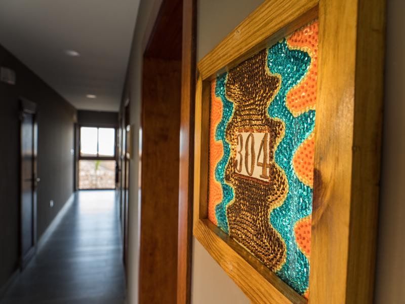 Corridor with hand-crafted room number art