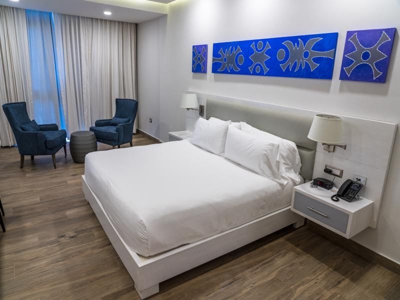 Bright guest room with king bed