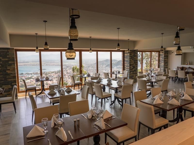 Restaurant tables set for dinner