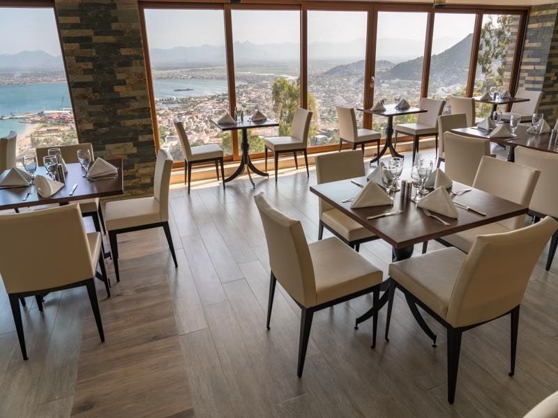 Restaurant with floor-to-ceiling windows over the bay