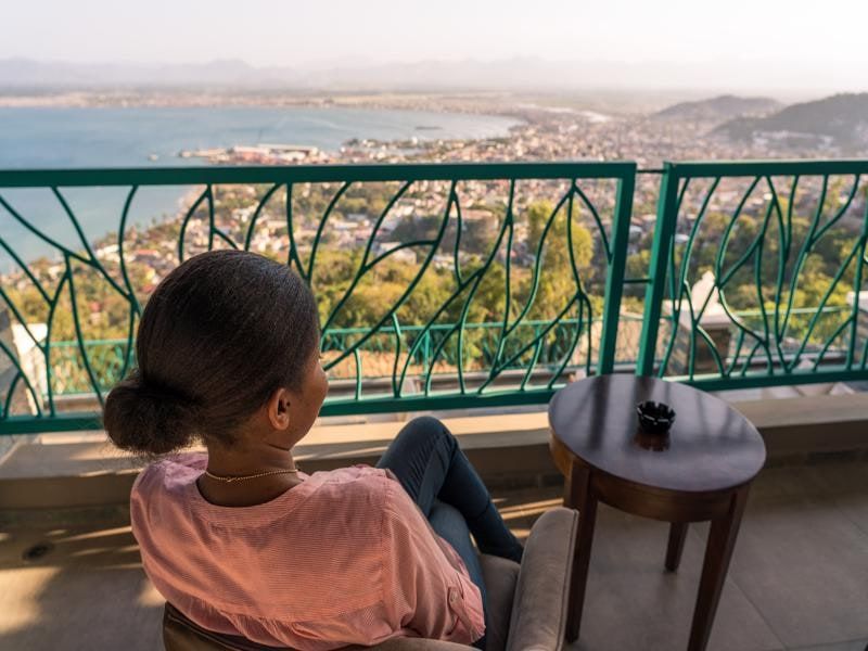 Guest on a balcony looking over the city