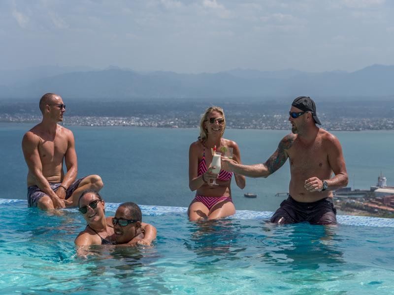 Guests enjoying cocktails in the pool