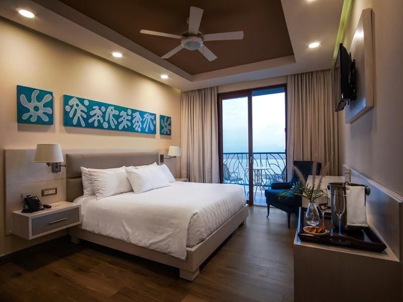 Guest room with balcony overlooking the bay